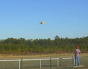 Larry Rash flying his giant Cub on a slow fly-by